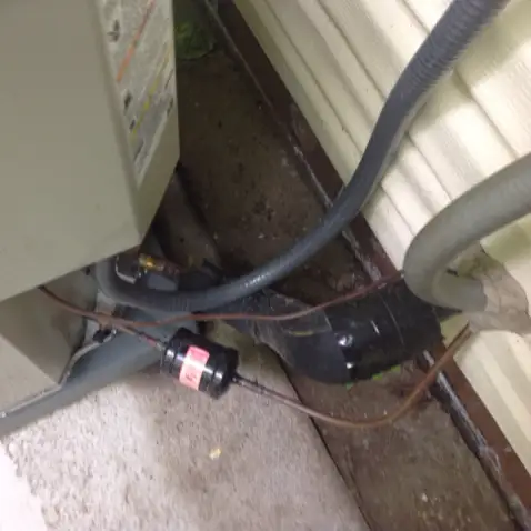 Missing insulation on AC coolant line in Cuyahoga County